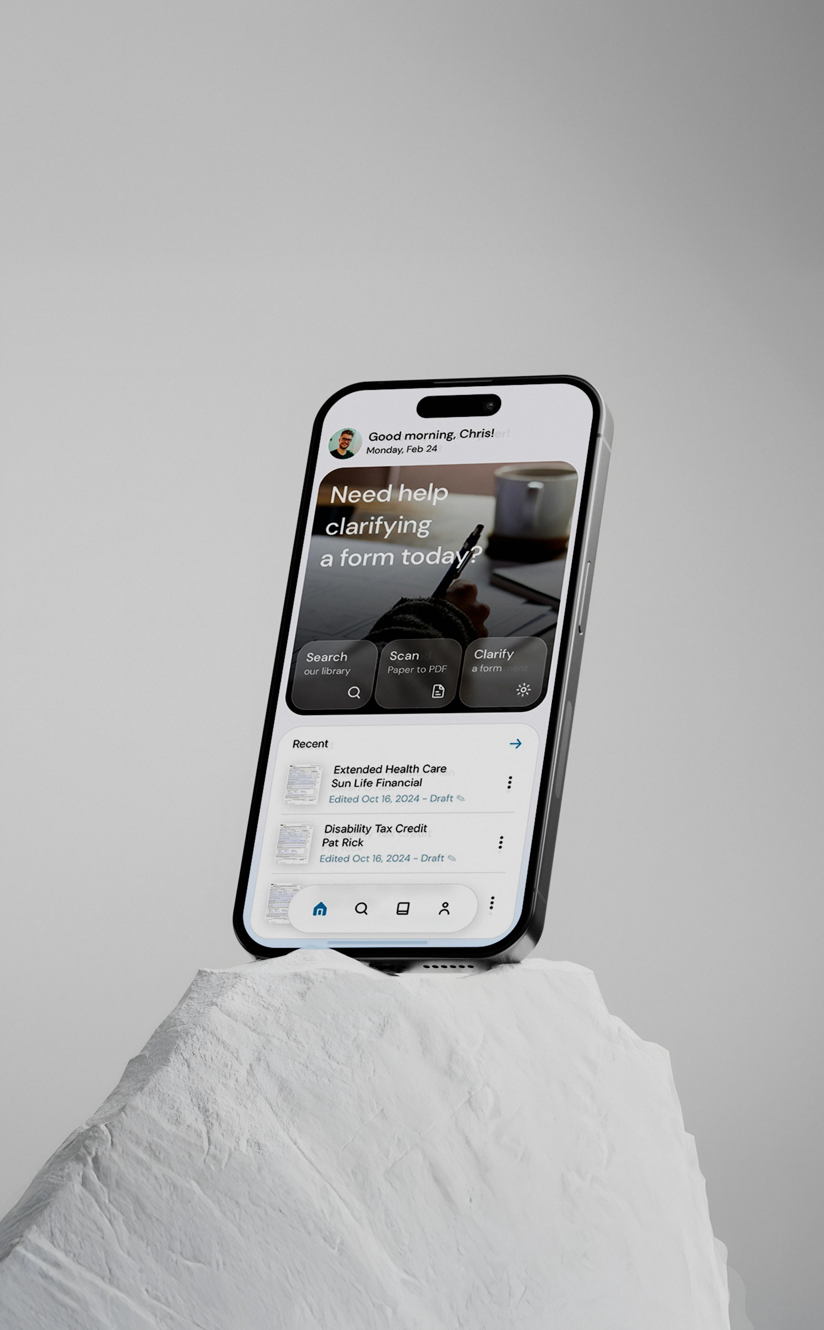 Aether home screen on a phone resting on a white stone